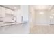 Modern kitchen with white cabinets, granite counters, and stainless faucet at 16503 66Th E Ln, Parrish, FL 34219