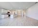 Open concept kitchen and living area with an eat-in kitchen, black appliances and island at 16503 66Th E Ln, Parrish, FL 34219