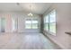 Open living area with large windows and a view to a backyard at 16503 66Th E Ln, Parrish, FL 34219