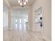 Bright, open-concept living room with neutral paint and tile floors at 16503 66Th E Ln, Parrish, FL 34219