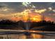 Scenic pond with a fountain and beautiful sunset at 16503 66Th E Ln, Parrish, FL 34219
