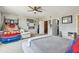 Spacious bedroom featuring unique decor and a ceiling fan at 1676 Arabian Ln, Palm Harbor, FL 34685