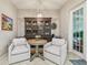Cozy dining area with large hutch and seating for two at 1676 Arabian Ln, Palm Harbor, FL 34685