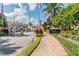 Welcoming entrance to Eagles Reserve with gate and lush landscaping at 1676 Arabian Ln, Palm Harbor, FL 34685