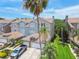Aerial view of townhomes with tile roofs, attached garages, and well-manicured lawns at 1676 Arabian Ln, Palm Harbor, FL 34685
