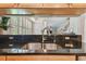 Looking into living room through kitchen pass through at 1676 Arabian Ln, Palm Harbor, FL 34685