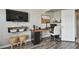 Office with a custom live edge desk, floating shelves, and a wall-mounted television at 1676 Arabian Ln, Palm Harbor, FL 34685