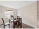 Bright and airy dining room with natural light, wood-look flooring, and minimalist decor creates an inviting space at 1700 Ironwood E Ct, Oldsmar, FL 34677