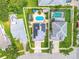 Aerial view showcasing the property, including a private pool, solar panels and well-maintained landscaping at 1807 Split Fork Dr, Oldsmar, FL 34677