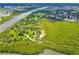 Aerial view of winding park trails surrounded by lush greenery and water features at 1807 Split Fork Dr, Oldsmar, FL 34677