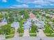 Aerial view of homes and a peaceful neighborhood lake, enhancing the community's appeal at 1807 Split Fork Dr, Oldsmar, FL 34677