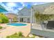 Spacious backyard featuring a pool, pergola, and lush landscaping at 1807 Split Fork Dr, Oldsmar, FL 34677