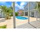 Backyard view featuring a pool, shed, and pergola at 1807 Split Fork Dr, Oldsmar, FL 34677