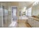 Bright bathroom featuring a soaking tub, shower, and dual vanity with granite countertops at 1807 Split Fork Dr, Oldsmar, FL 34677