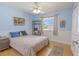 Cozy bedroom featuring blue walls, a comfortable bed, and a charming bookshelf for storage and display at 1807 Split Fork Dr, Oldsmar, FL 34677