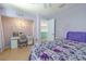 Bright bedroom with a desk and a view into another room, ideal for work or relaxation at 1807 Split Fork Dr, Oldsmar, FL 34677