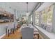 Well-lit dining room with an elegant chandelier, an abundance of windows and breakfast bar seating at 1807 Split Fork Dr, Oldsmar, FL 34677