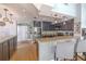 Eat-in kitchen with stainless steel appliances, granite countertops, breakfast bar, and dark cabinets at 1807 Split Fork Dr, Oldsmar, FL 34677