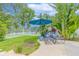 Relaxing lawn area with lounge chairs and a tranquil lake view at 1807 Split Fork Dr, Oldsmar, FL 34677