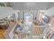 Bright living room showcasing hardwood floors and sliding glass doors to the pool at 1807 Split Fork Dr, Oldsmar, FL 34677