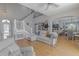 Open-concept living room, featuring hardwood floors, staircase, open flow to kitchen and dining areas at 1807 Split Fork Dr, Oldsmar, FL 34677