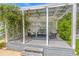 Charming pergola with comfortable seating, creating a relaxing outdoor living space at 1807 Split Fork Dr, Oldsmar, FL 34677