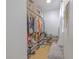 Custom walk-in closet with ample shelving and storage, including natural light at 1807 Split Fork Dr, Oldsmar, FL 34677