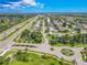 Aerial view of the community showcasing nearby roadways and lush green landscaping at 1838 Eagle Ridge Blvd, Palm Harbor, FL 34685