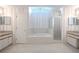 Bathroom with a soaking tub, glass shower, and dual vanities at 1838 Eagle Ridge Blvd, Palm Harbor, FL 34685