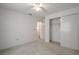 Bright bedroom features neutral carpet, a closet, and a ceiling fan at 1838 Eagle Ridge Blvd, Palm Harbor, FL 34685