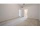 Empty bedroom featuring neutral paint and carpet at 1838 Eagle Ridge Blvd, Palm Harbor, FL 34685