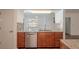Updated kitchen featuring stainless dishwasher, granite countertops, and modern fixtures at 1838 Eagle Ridge Blvd, Palm Harbor, FL 34685