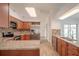 Bright kitchen with stainless steel appliances, granite countertops, and modern tile backsplash at 1838 Eagle Ridge Blvd, Palm Harbor, FL 34685