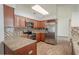 Well-equipped kitchen with modern appliances, wooden cabinets, and granite countertops at 1838 Eagle Ridge Blvd, Palm Harbor, FL 34685