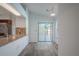 View of kitchen bar area featuring granite countertops and stainless steel sink at 1838 Eagle Ridge Blvd, Palm Harbor, FL 34685