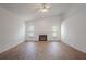 Bright living room featuring a fireplace, tile floors, and a vaulted ceiling at 1838 Eagle Ridge Blvd, Palm Harbor, FL 34685