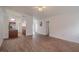 Open floor plan showing the living room with tile floors flowing into the kitchen at 1838 Eagle Ridge Blvd, Palm Harbor, FL 34685
