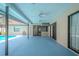 Covered outdoor patio with ceiling fans and a view of the backyard pool area at 1838 Eagle Ridge Blvd, Palm Harbor, FL 34685