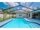 Inviting screened-in pool offers a refreshing escape on a sunny day at 1838 Eagle Ridge Blvd, Palm Harbor, FL 34685