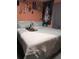 Bedroom with bed and accessories against a coral wall with decorations, offering a tranquil personal space at 18804 Tournament Trl, Tampa, FL 33647