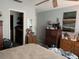 Bedroom with a walk-in closet, dressers and soft neutral colors at 18804 Tournament Trl, Tampa, FL 33647