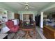 Cozy dining room featuring a large wooden table and a floral rug at 18804 Tournament Trl, Tampa, FL 33647