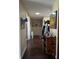 Inviting hallway showcasing hardwood floors and charming decor at 18804 Tournament Trl, Tampa, FL 33647