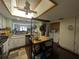 Open kitchen features a center island, white cabinets, and ample counter space at 18804 Tournament Trl, Tampa, FL 33647
