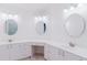 Large bathroom featuring dual sinks, plenty of storage, and bright lighting at 1974 Hidden Springs Pl, Clearwater, FL 33760