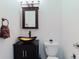 Stylish bathroom features a vessel sink and dark wood vanity cabinet at 1974 Hidden Springs Pl, Clearwater, FL 33760