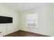 Comfortable bedroom features wood-look floors and large window at 1974 Hidden Springs Pl, Clearwater, FL 33760