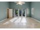 Bedroom with tile flooring and access to outdoor living at 1974 Hidden Springs Pl, Clearwater, FL 33760