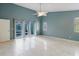Bedroom featuring tile flooring, white trim, and access to outdoor living space through sliding glass doors at 1974 Hidden Springs Pl, Clearwater, FL 33760
