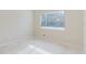Bright bedroom with tile floors and a large window at 1974 Hidden Springs Pl, Clearwater, FL 33760